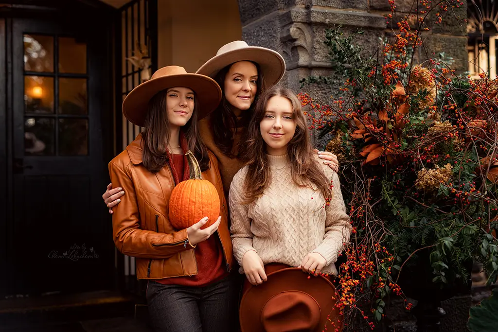 Family photographed outdoors in soft evening light