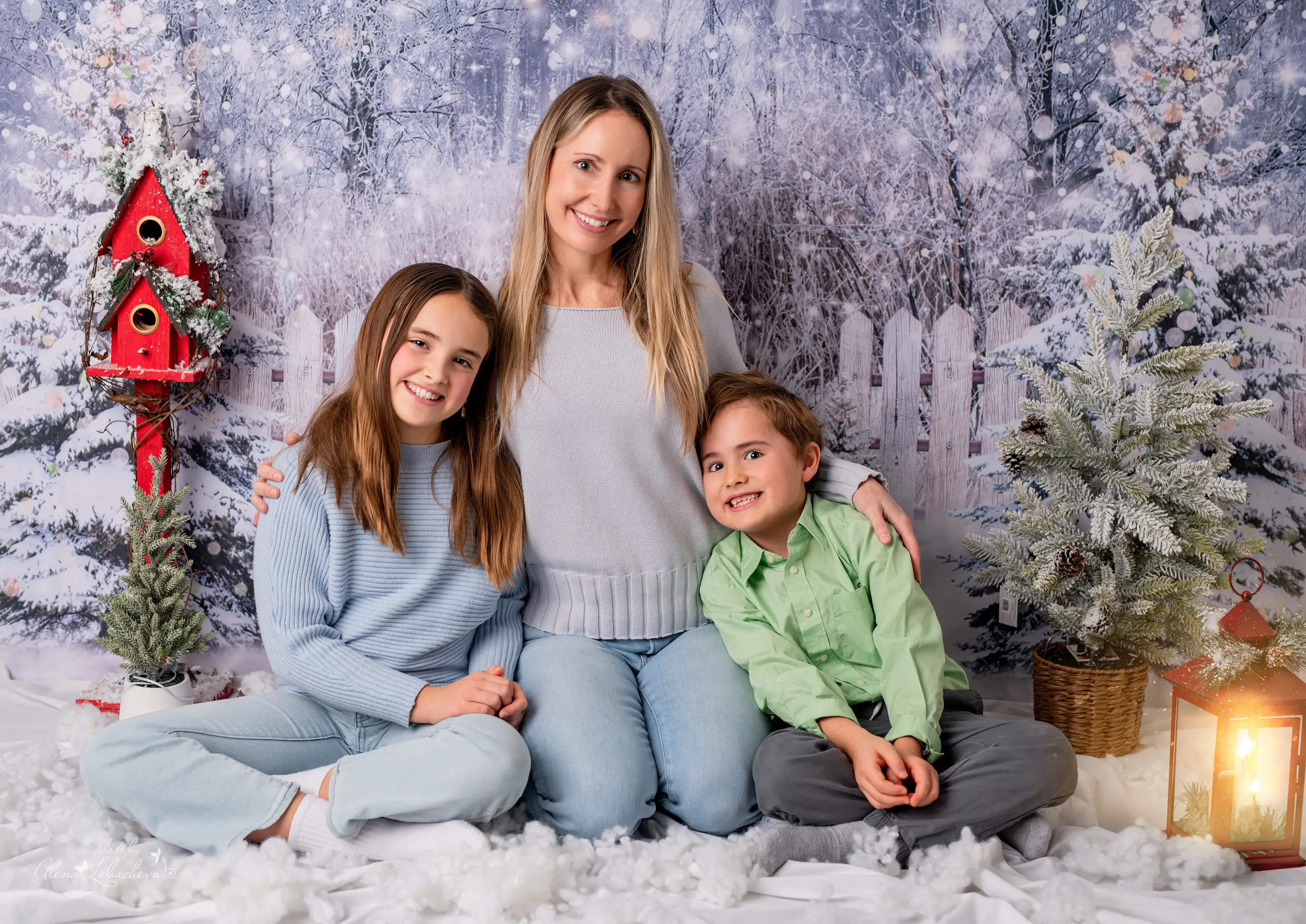 Mother with her children in a winter holiday studio portrait