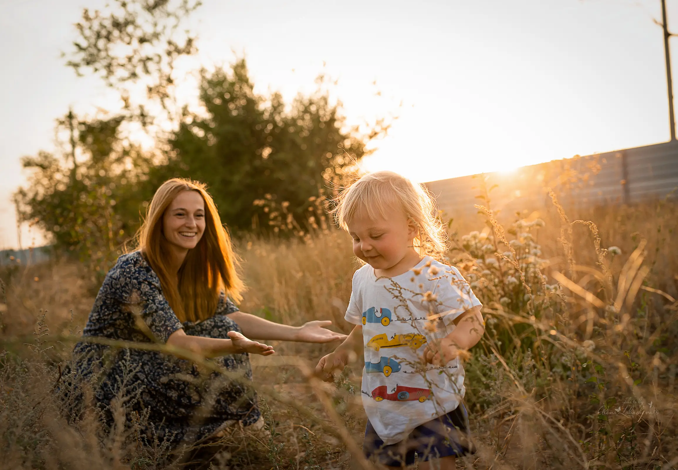 Mother and toddler playing in warm golden-hour light