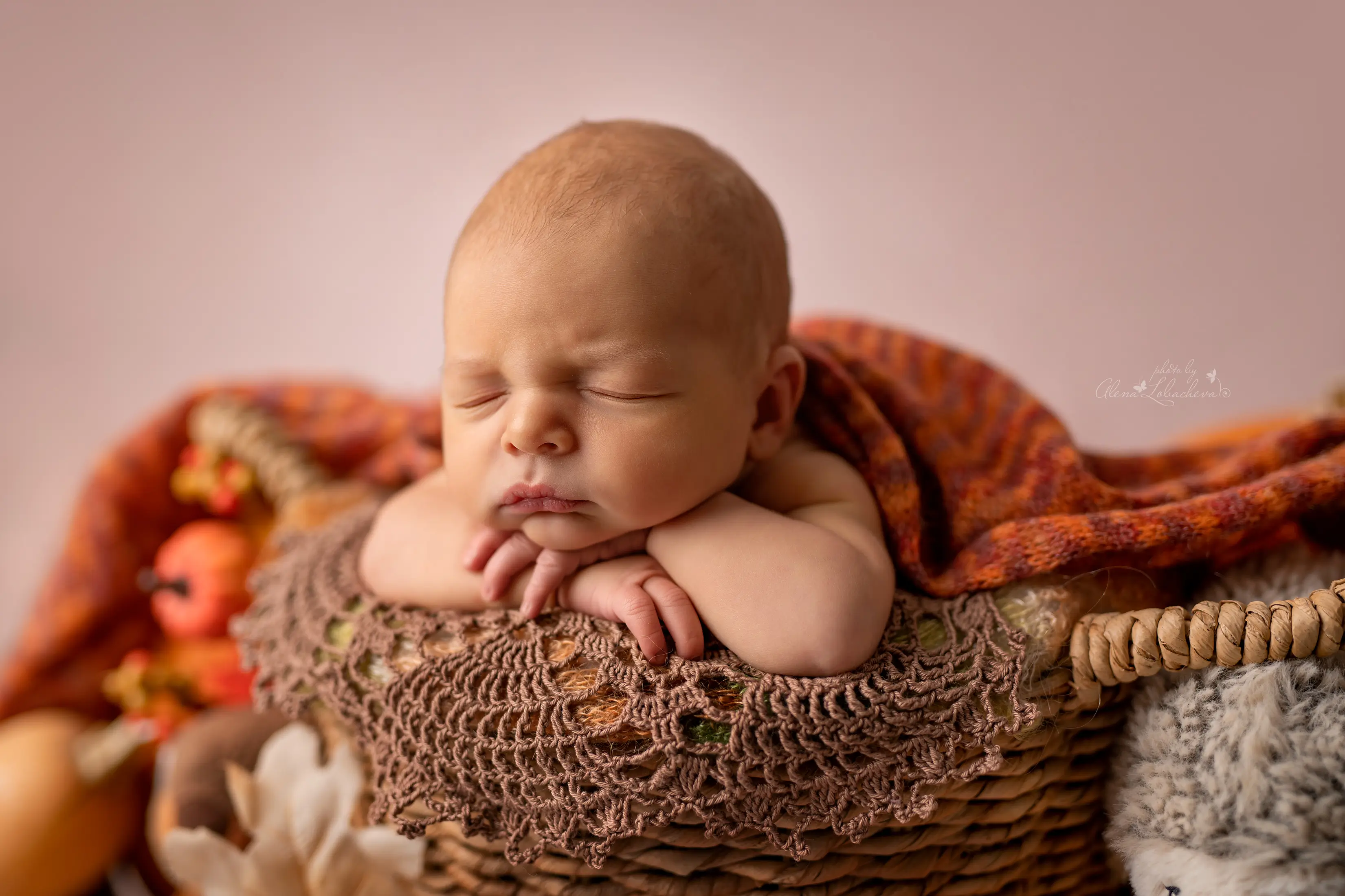 Calm newborn baby resting before a photography session